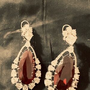 Elegant Silver and Red Teardrop Earrings with CZ all around the red stone.